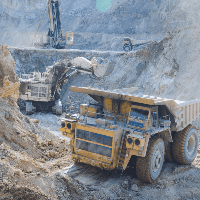 Mining trucks and heavy equipment related to Rio Tinto Glencore merger scale