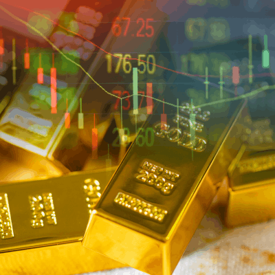 Investor analyzing gold and silver ETF charts on a laptop during market correction